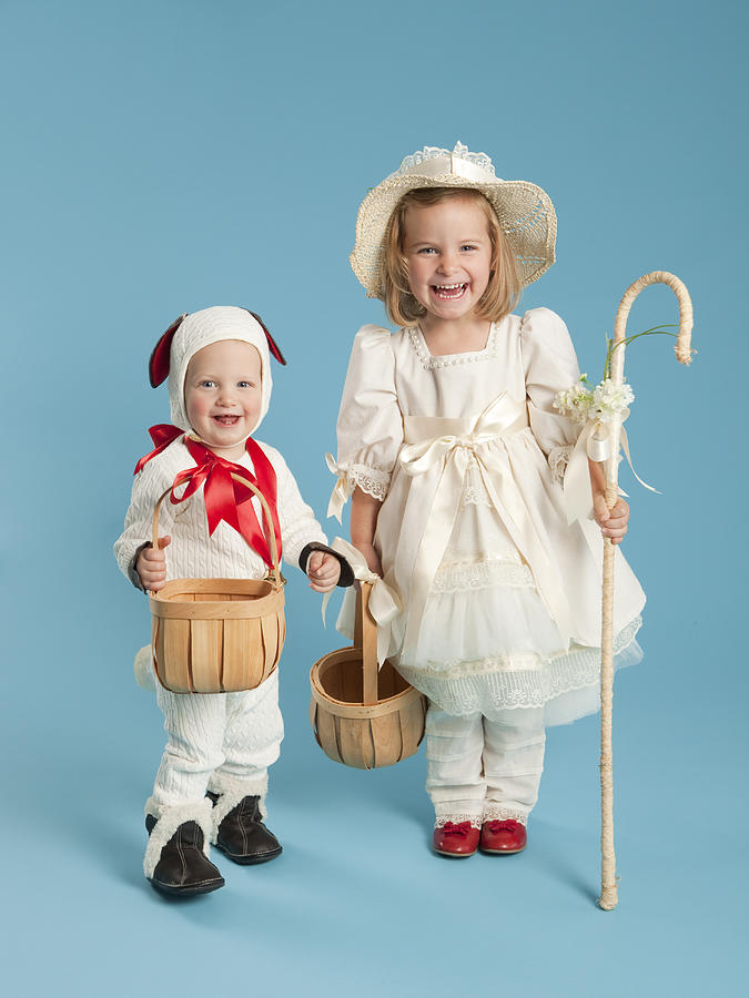 Portrait of girl (2-3) as Little Bo Peep with boy (12-17 months) as lamb for Halloween Photograph by Nicole Hill Gerulat