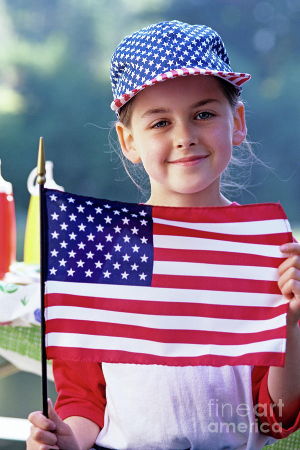 Portrait Of Girl Holding The American Flag Photograph