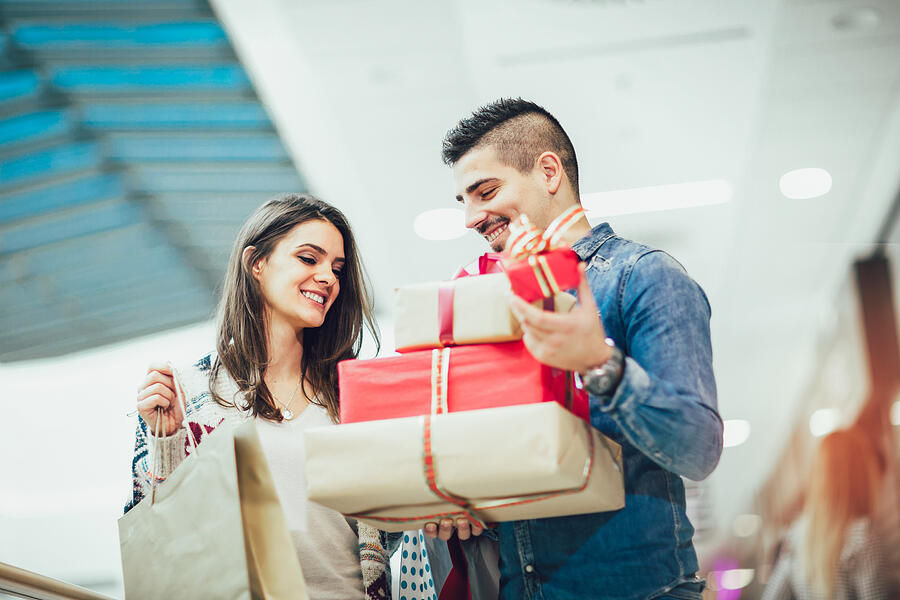 Portrait of happy couple with Christmas presents Photograph by Jovanmandic