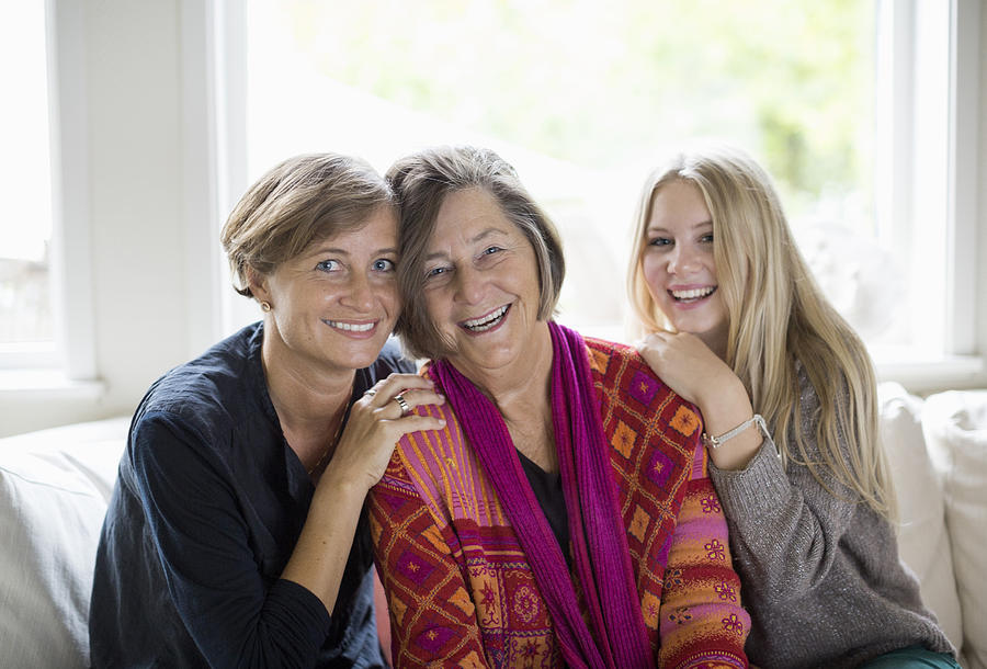 Portrait of happy three generation females in living room Photograph by Maskot