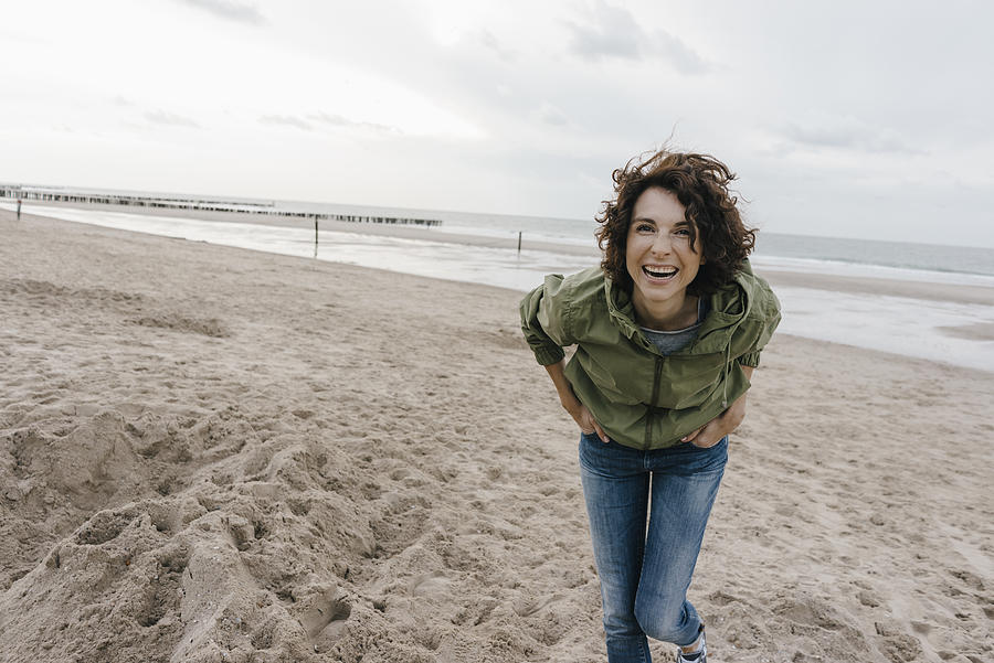 Portrait of happy woman on the beach Photograph by Westend61