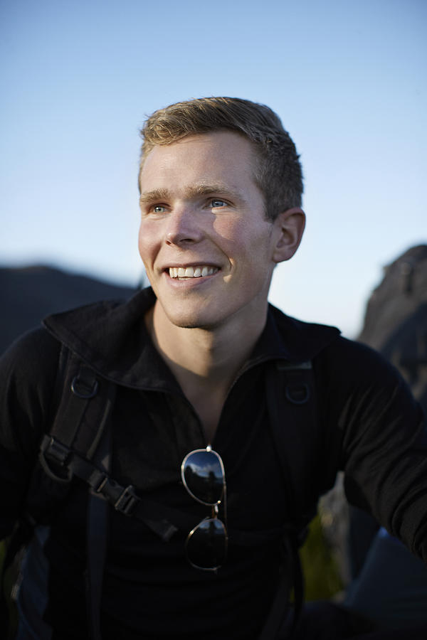 Portrait of male backpacker smiling Photograph by Klaus Vedfelt