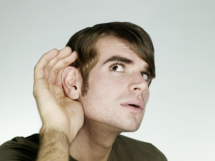 Portrait of man listening Photograph by Flashpop
