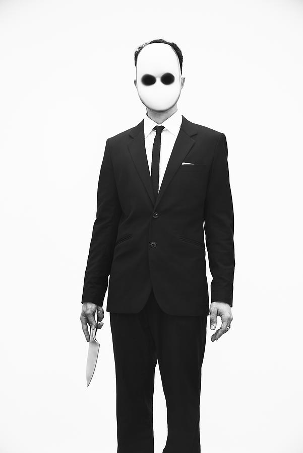Portrait Of Man With Mask On And Knife In Hand Photograph by Nisian Hughes
