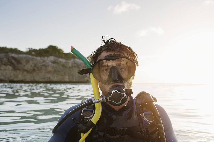 Portrait of man with scuba diving equipment in sea Photograph by Felix Wirth