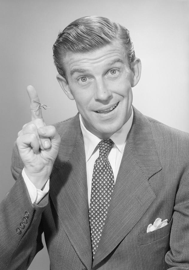 Portrait of mature man with thread tied around finger Photograph by George Marks