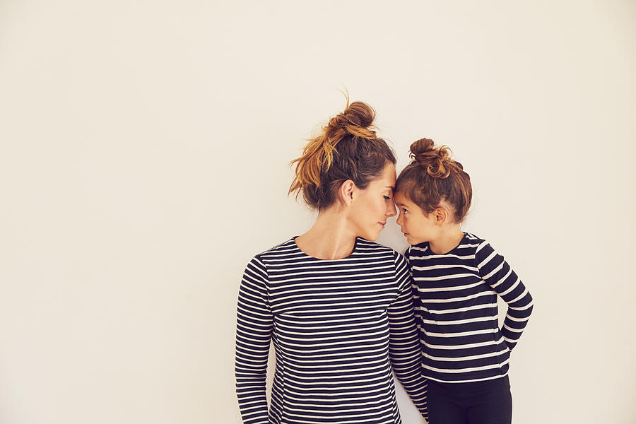 Portrait of mother and daughter, face to face Photograph by Emma Kim