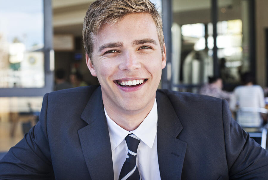 Portrait of relaxed businessman in suit, smiling Photograph by Dimitri Otis