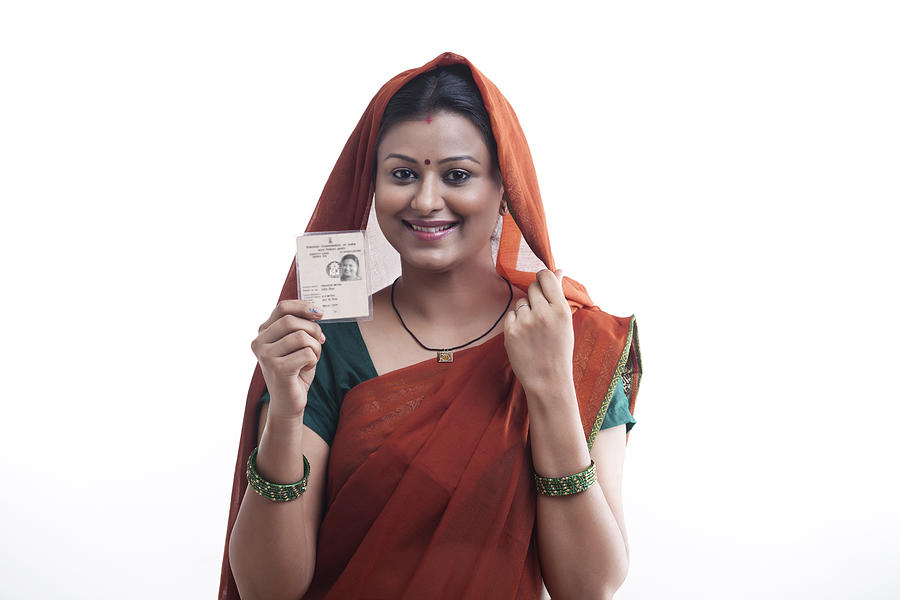 Portrait of rural woman with identity card Photograph by Hemant Mehta
