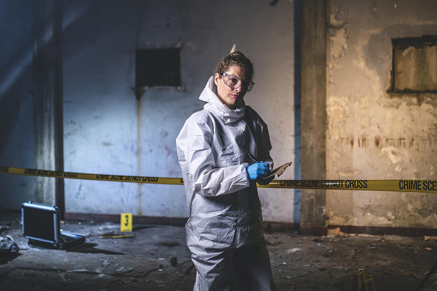 Portrait of Serious Crime Scene Investigator Making Notes Photograph by AzmanJaka