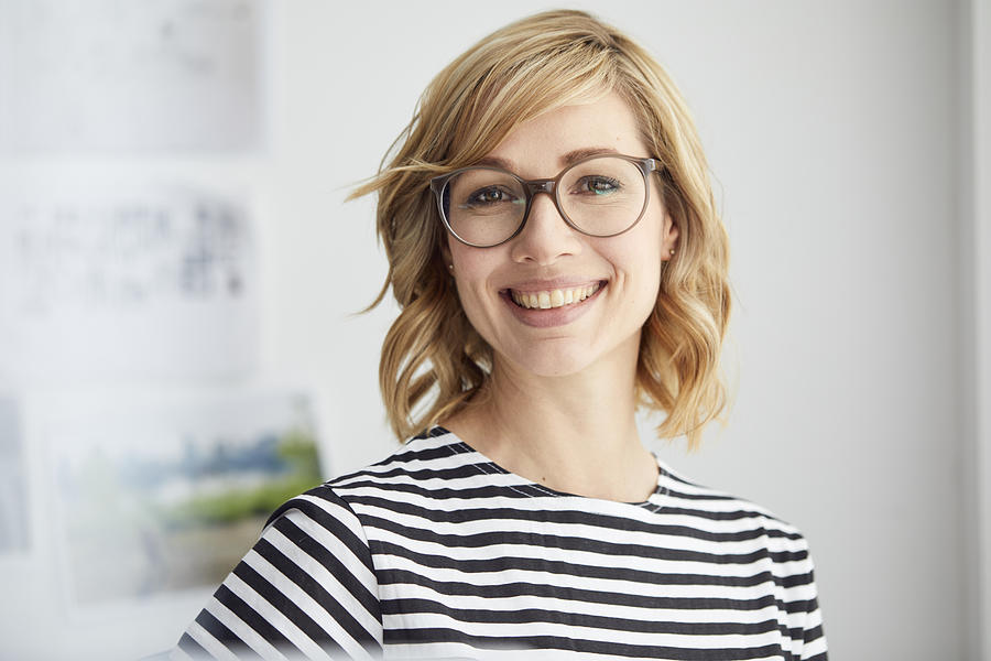 Portrait of smiling blond woman, glasses Photograph by Westend61
