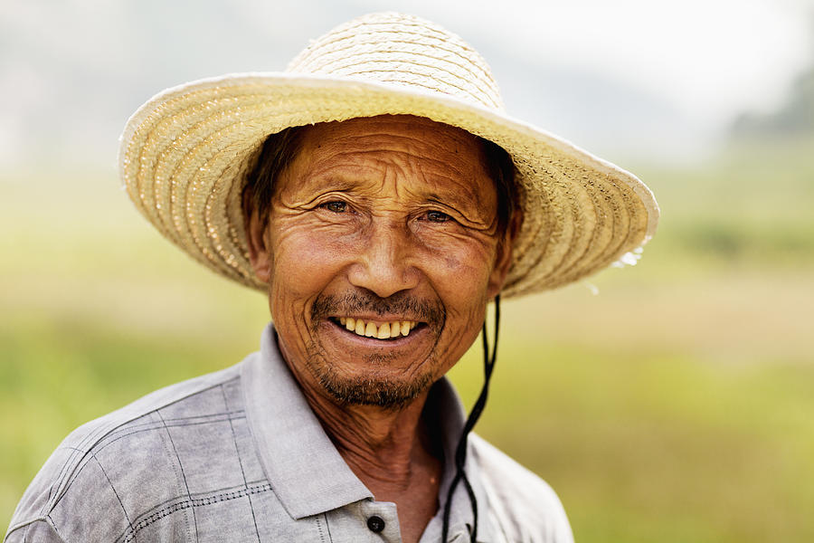 Portrait of smiling farmer, rural China, Shanxi Province Photograph by XiXinXing