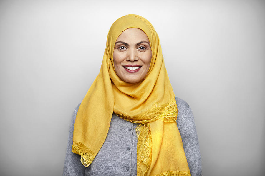 Portrait of Smiling Mid Adult Woman Wearing Hijab. Photograph by Morsa Images