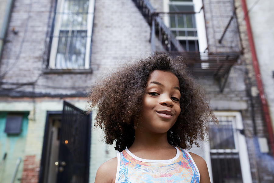 Portrait of smirking Mixed Race girl Photograph by Granger Wootz
