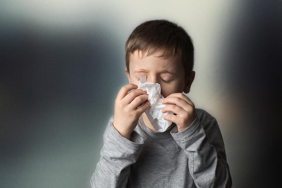 Portrait of sneezing boy Photograph by Stefka Pavlova