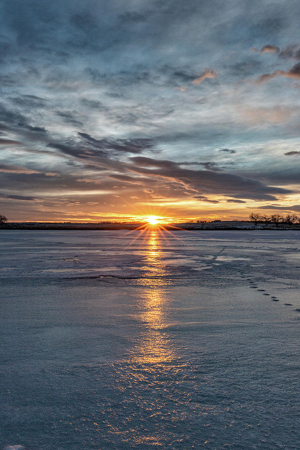 Portrait of Starburst Sunrise Across a Frozen Lake Photograph by Tony ...