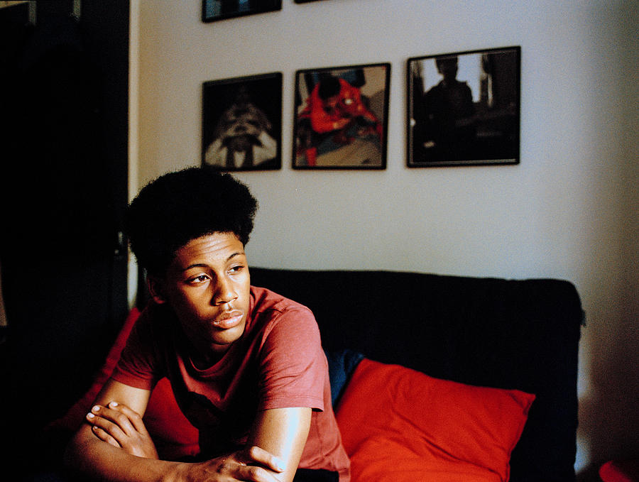 Portrait Of Teenage Boy In His Bedroom Photograph by Alys Tomlinson