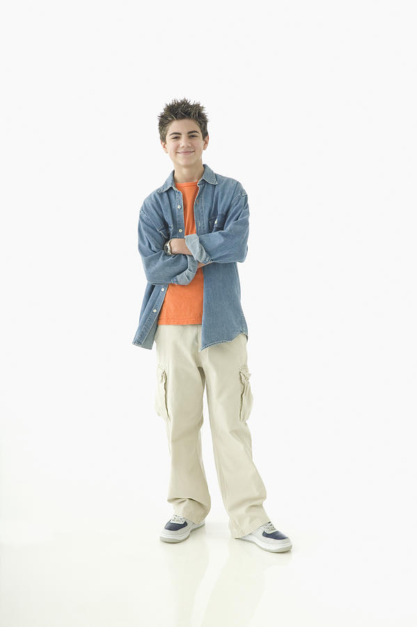 Portrait of teenage boy standing with arms crossed Photograph by Jose Luis Pelaez Inc