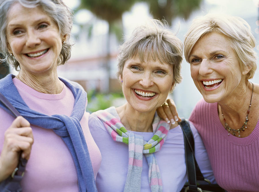 Portrait of three mature women smiling Photograph by Stockbyte