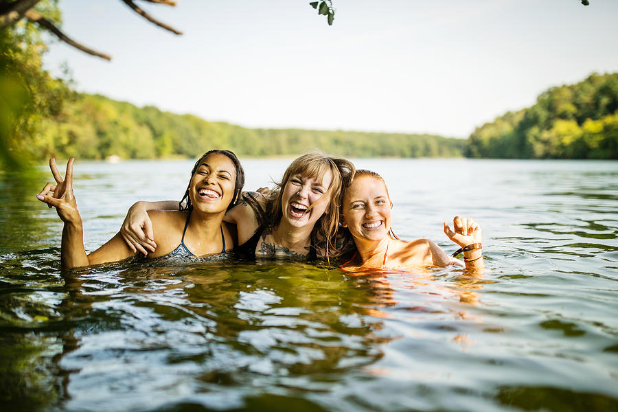 Portrait of three young women together in lake Photograph by Luis Alvarez