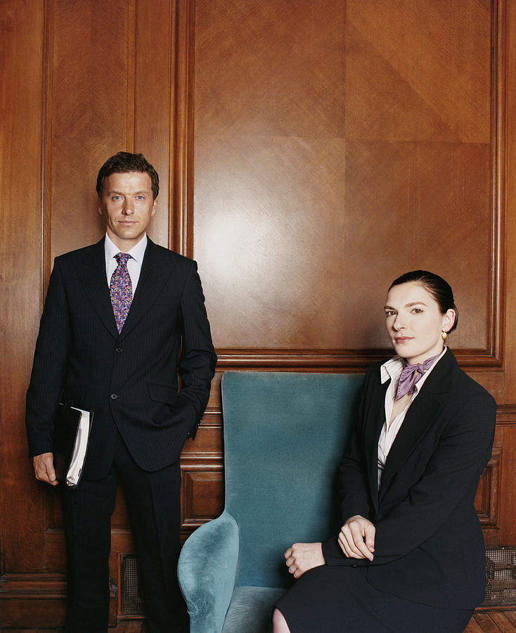Portrait of Two Business Executives Around an Armchair Photograph by A J James