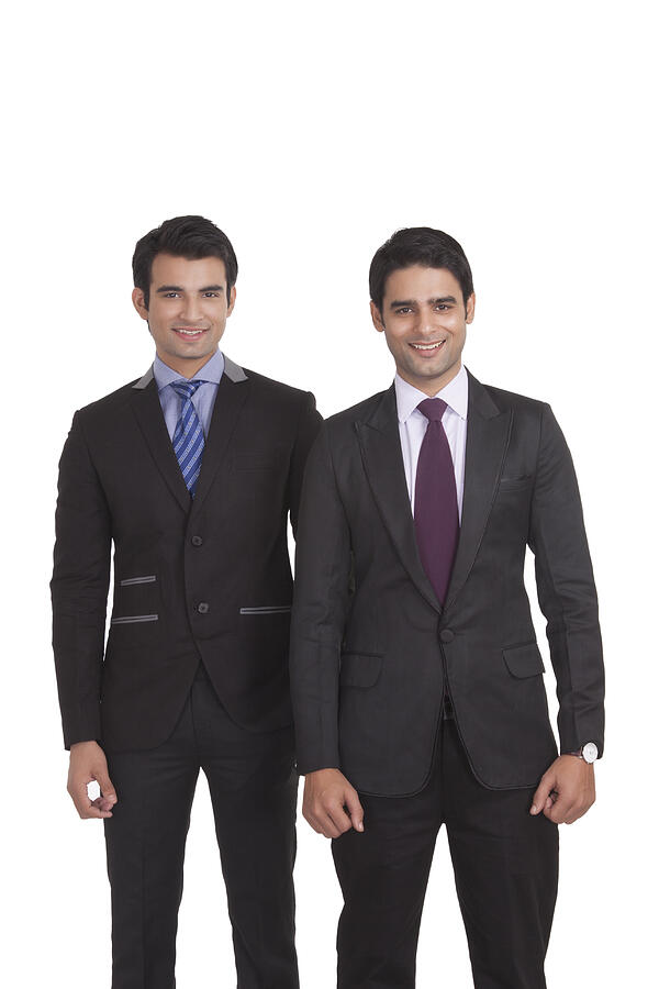 Portrait of two businessmen smiling Photograph by IndiaPix/IndiaPicture