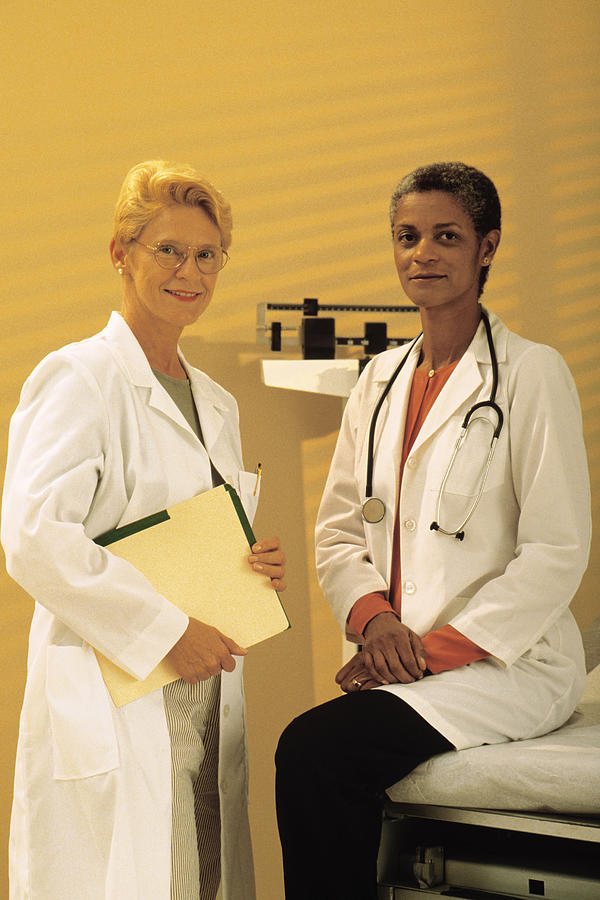 Portrait of two female doctors Photograph by Comstock