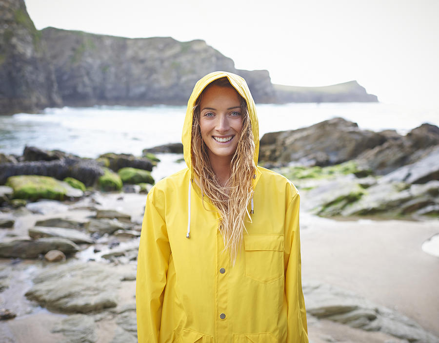 Portrait of woman in yellow raincoat Photograph by Dougal Waters