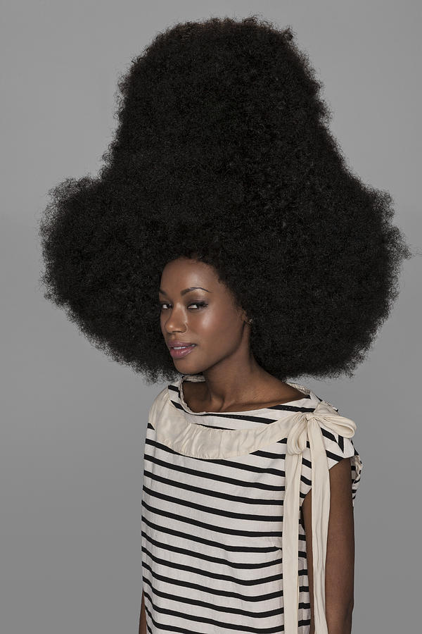 Portrait of woman with very large afro Photograph by Nisian Hughes
