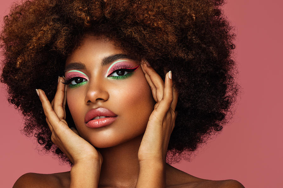 Portrait of young afro woman with bright make-up Photograph by CoffeeAndMilk