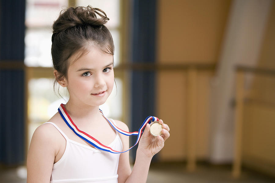 Portrait Of Young Ballet Dancer Holding Medal Photograph by Beyond Foto