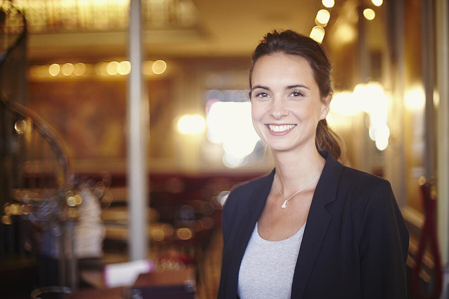 Portrait of young businesswoman in restaurant Photograph by Cultura RM Exclusive/Twinpix