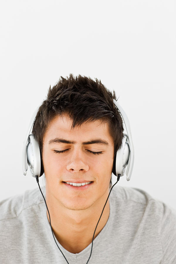Portrait Of Young Man Listening To Music Photograph by Neustockimages
