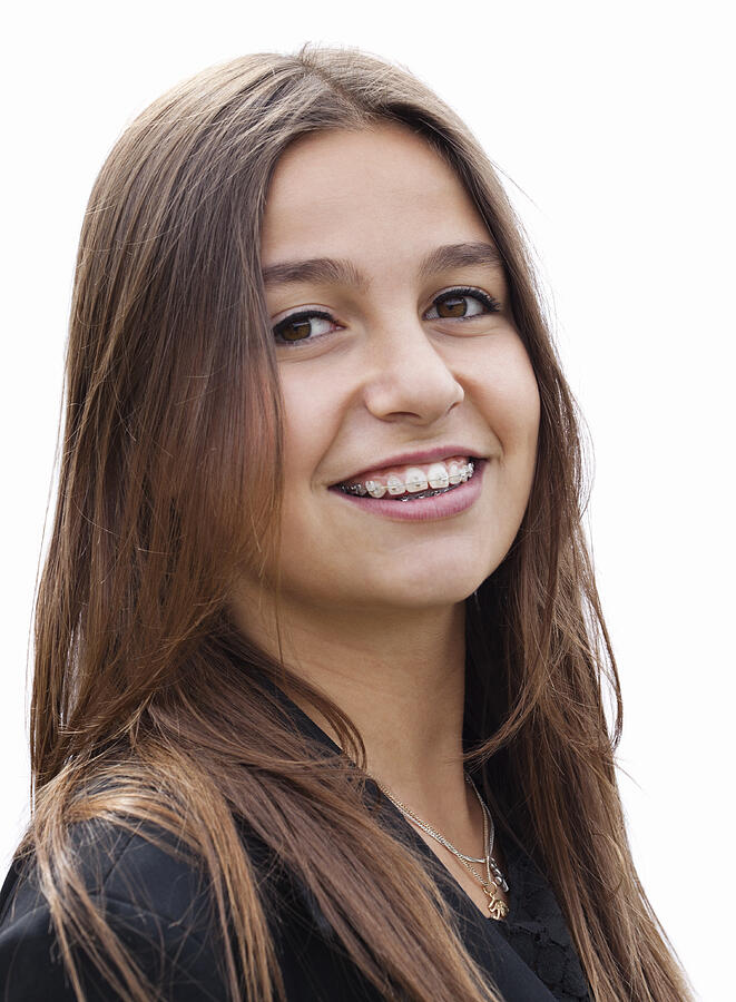 Portrait of young woman with braces, smiling Photograph by Compassionate Eye Foundation/Gabriela Medina