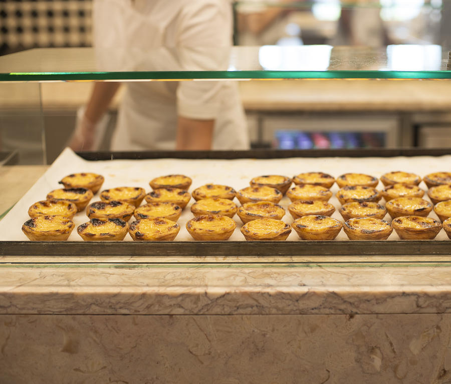 Portuguese custard tarts ( Pastel de nata) for sale in Portuguese market Photograph by Lyn Holly Coorg