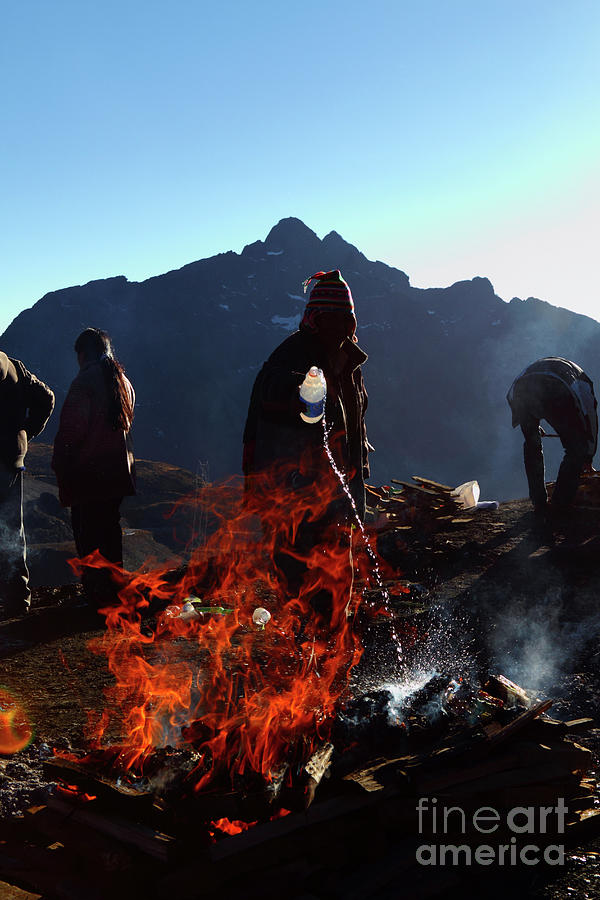 Pouring fuel on Pachamamas fire Bolivia Photograph by James Brunker