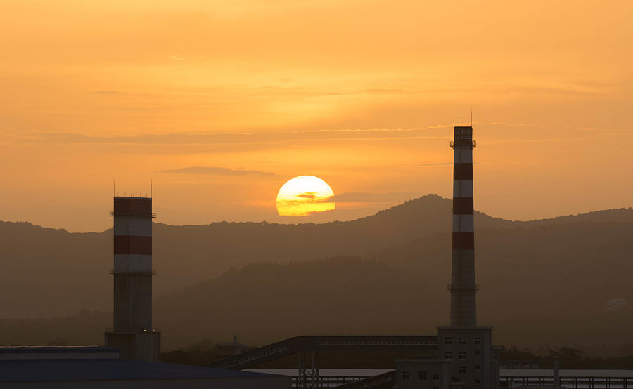 Power plant with setting sun Photograph by Arhendrix