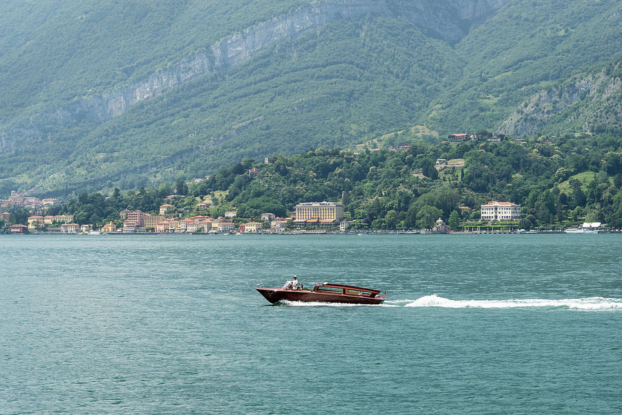Powerboating Across Lake Como - Wooden Power Boat and Tremezzo Village Photograph by Georgia Mizuleva