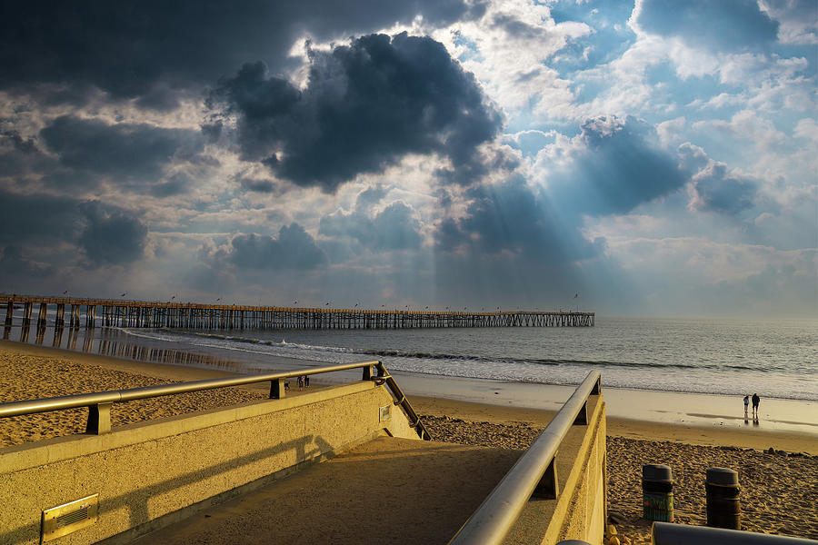 Powerful Clouds Over the Pier Photograph by Marcus Jones