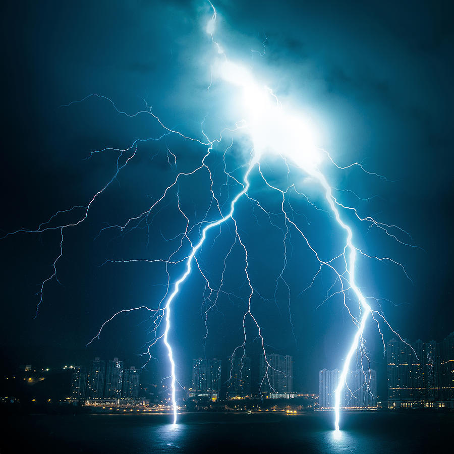 Powerful lightning striking from sky to sea Photograph by D3sign