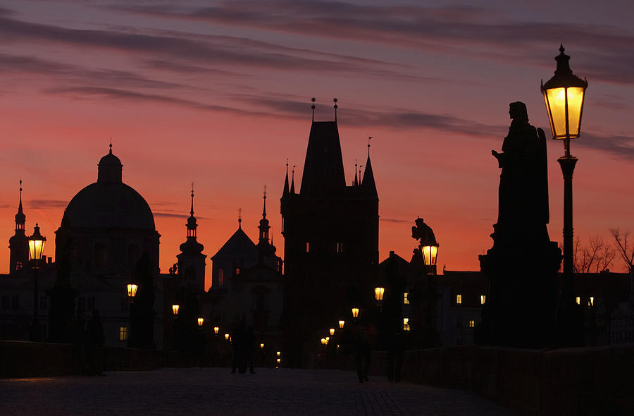 Prague, Charles Bridge, silhouette of city skyline, sunset Photograph by Akis Rys