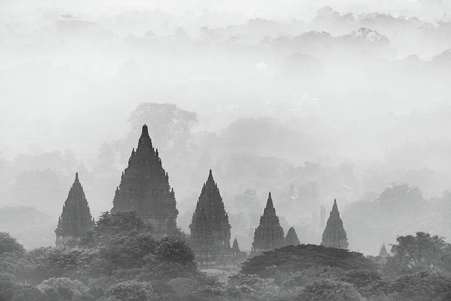 Prambanan temple on a foggy morning in black and white Photograph by Anges Van der Logt