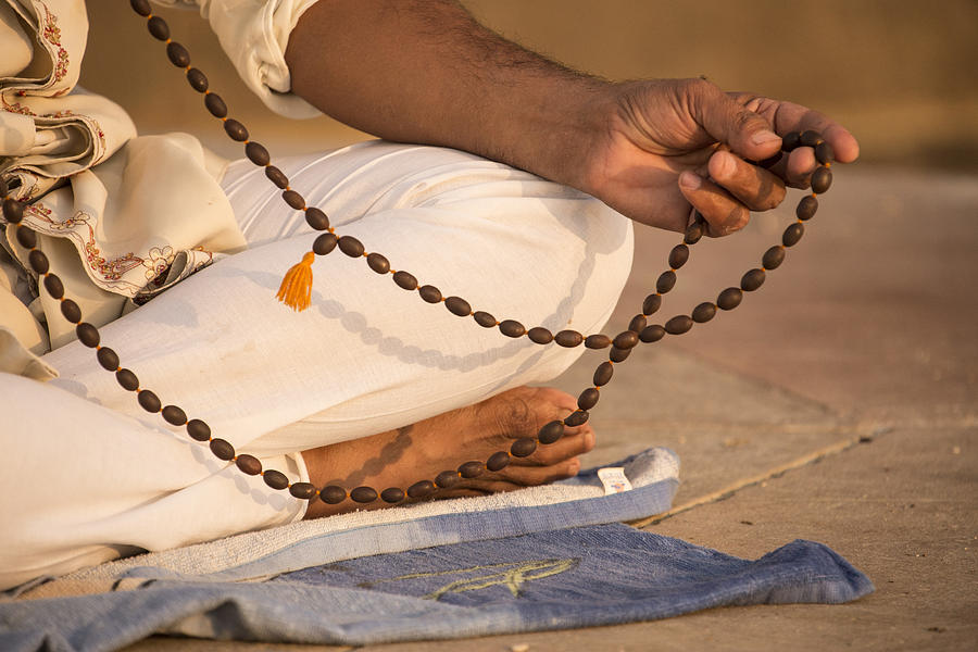 Prayer beads, a man meditating, Varanasi, India Photograph by David Clapp