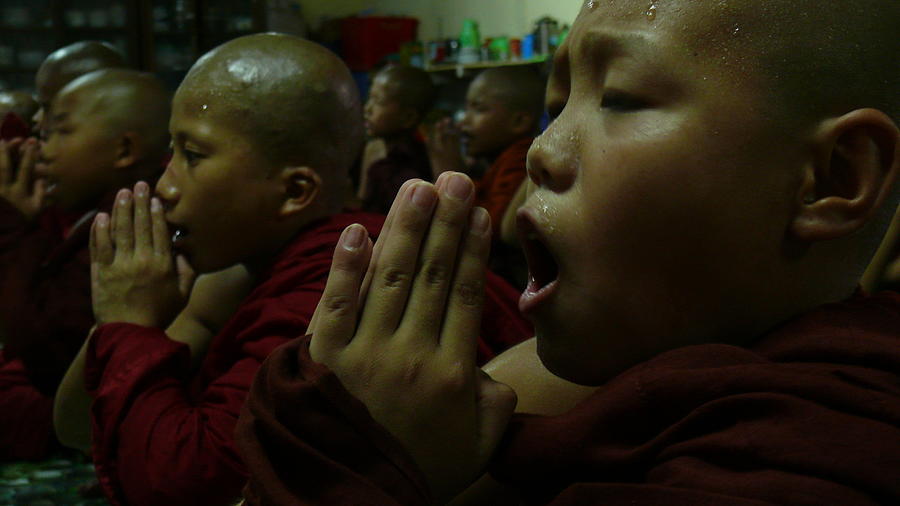 Prayer of Young Monks Photograph by Robert Bociaga