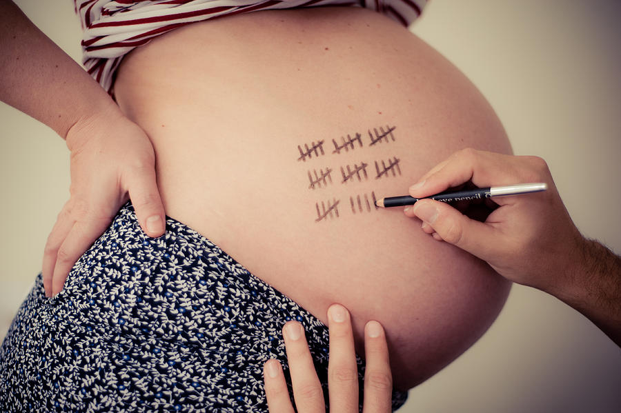 Pregnant lady with 39 lines drawn on stomach Photograph by All images by Bettina Bhandari