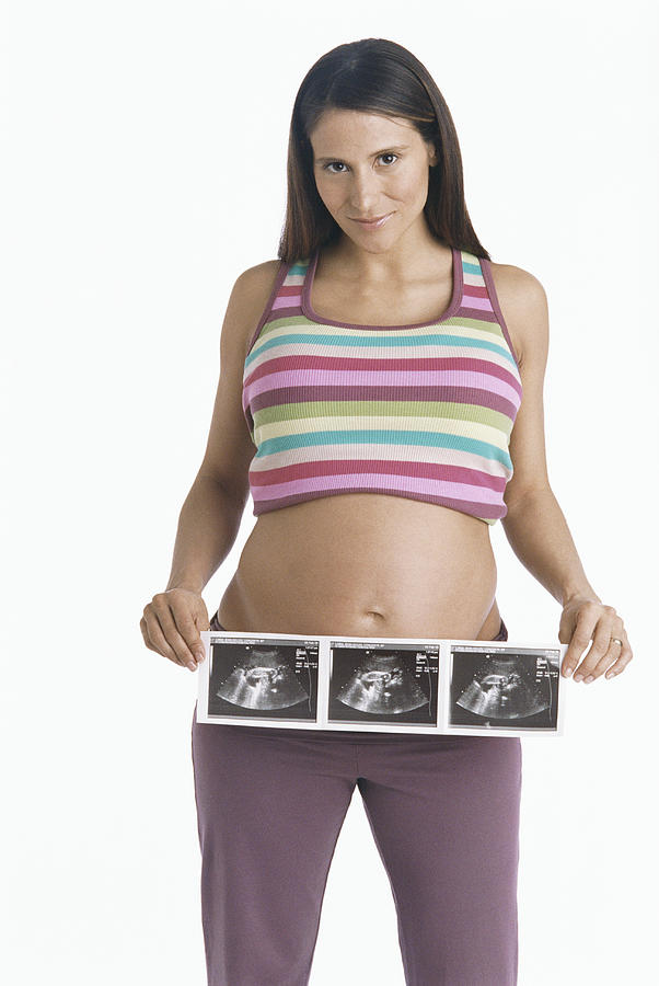 Pregnant Woman Holding a Ultrasound Photograph Photograph by Nancy Ney