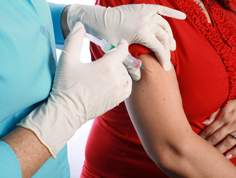 Pregnant Woman Receives Swine Flu Shot Photograph by AvailableLight