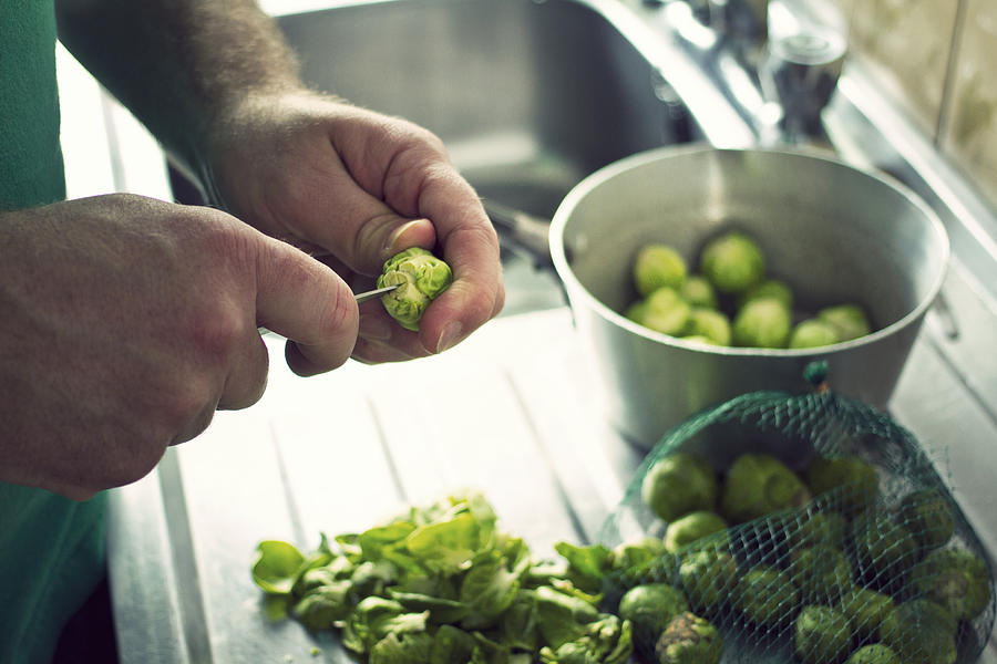 Preparing Brussels Sprouts Photograph by Catherine MacBride