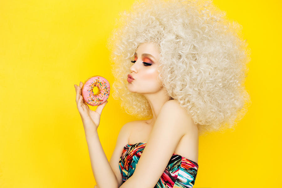 Pretty blonde with pink donuts Photograph by CoffeeAndMilk