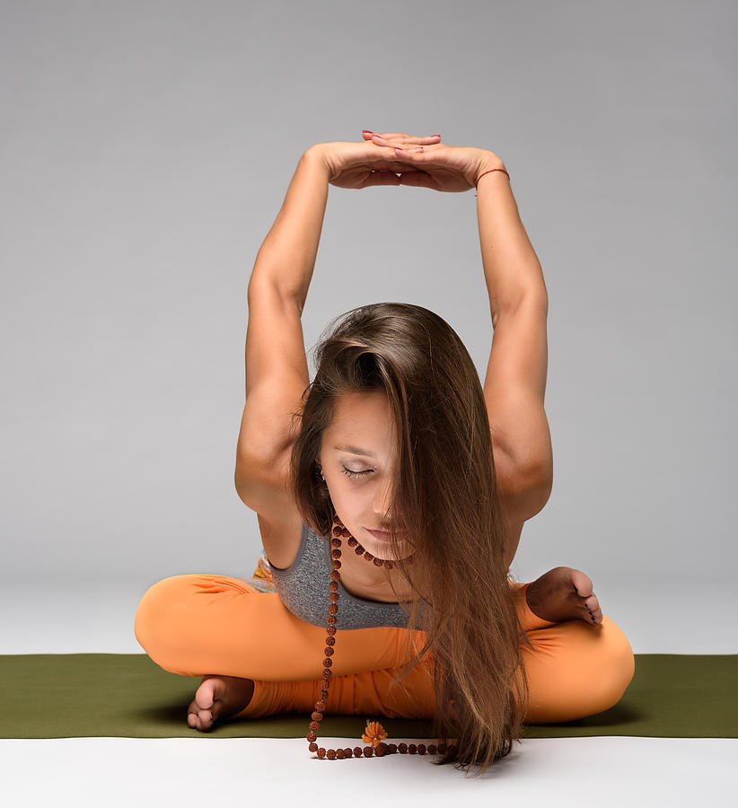 Pretty girl practicing yoga Photograph by Roman Baiadin